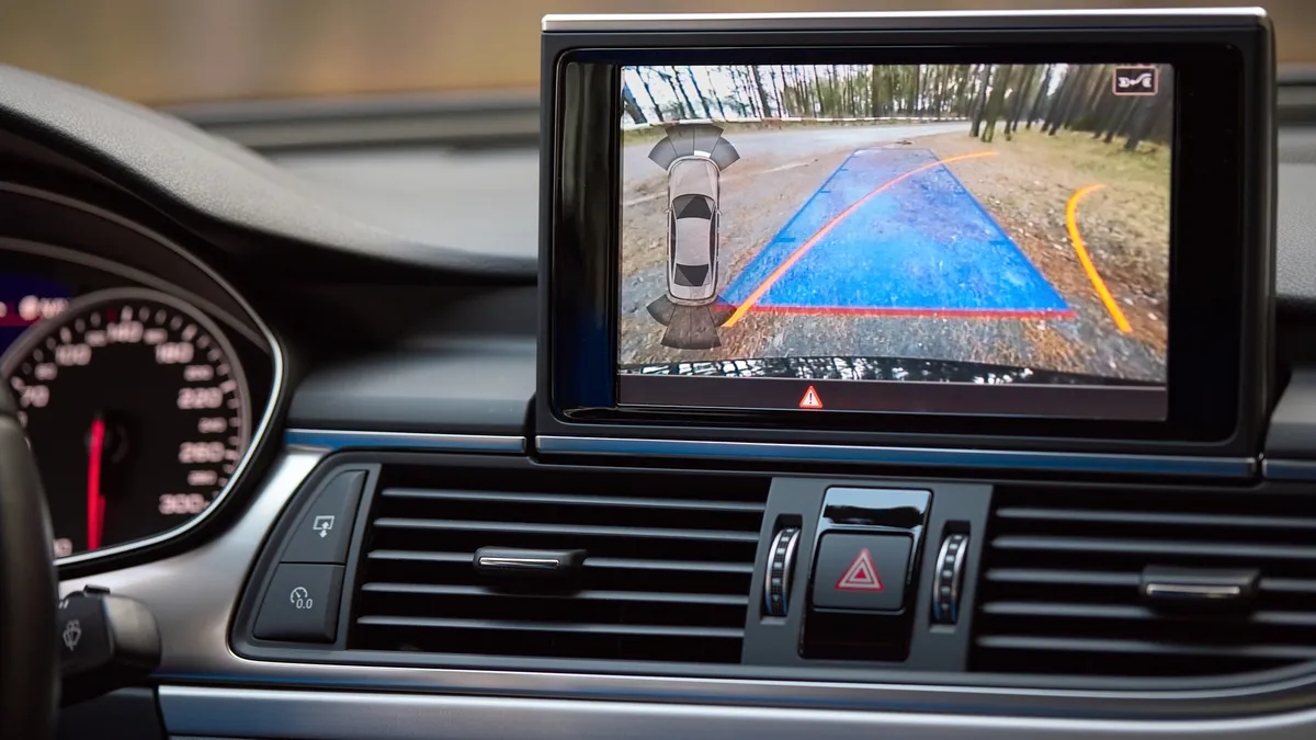 A cockpit of a car with driver assist features.