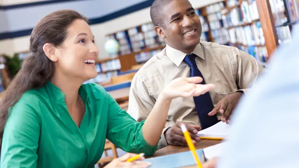 Woman explaining something to group of friends