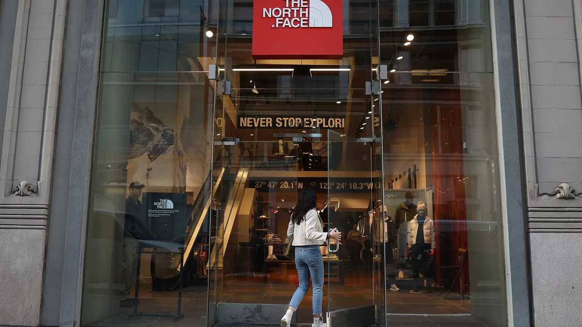 A customer enters The North Face store.