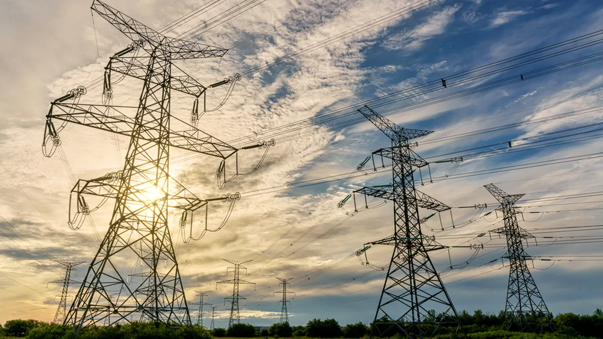 Hydro transmission towers and electricity power lines in the morning.