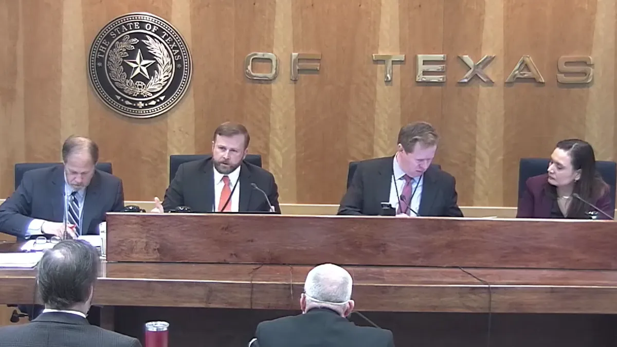 An image from the Public Utilities Commission of Texas meeting on Feb. 25 showing all four commissioners.