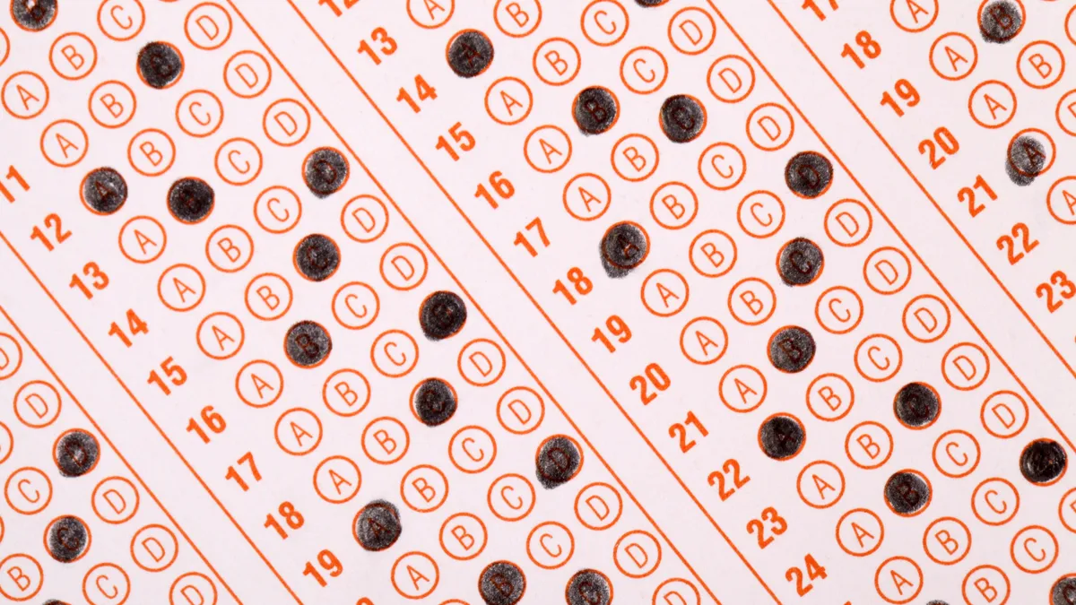 A close up of a fill-in-the-bubble exam sheet, with some of the bubbles darkened.