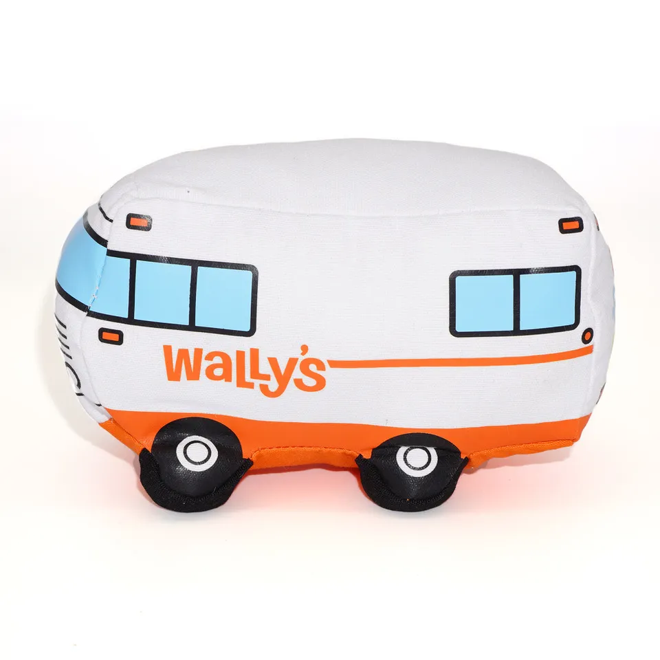 A photo of an orange and white dog toy shaped like a winnebago. On the side it says &quot;Wally&#x27;s.&quot;