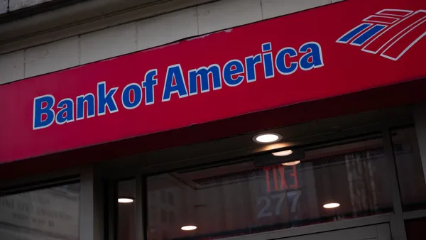 A red sign reads "Bank of America" with the bank's flag logo next to it.