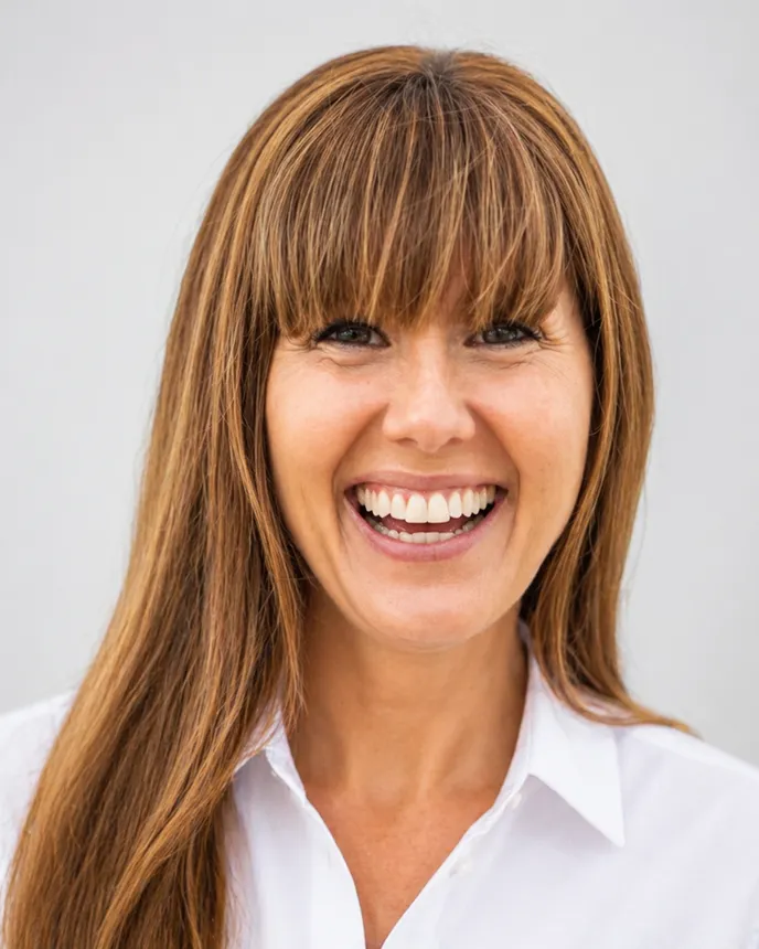 Headshot of a woman in business attire.
