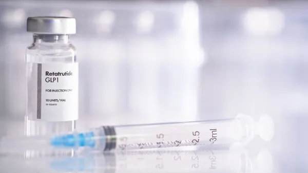 A photo depicting a vial of Eli Lilly's obesity drug retatrutide and a syringe.