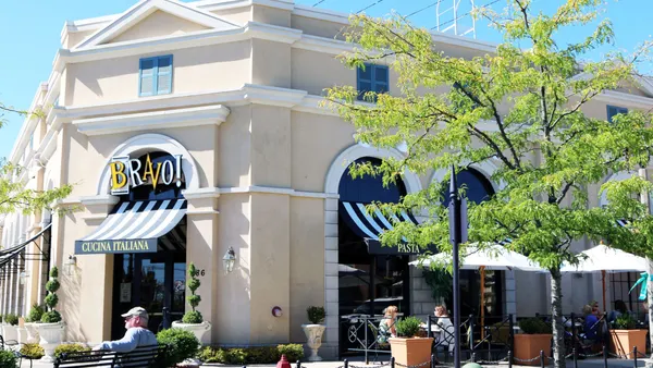 A beige building with Barvo! Cucina Italiana logo