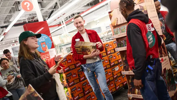 Target staff assist customers.