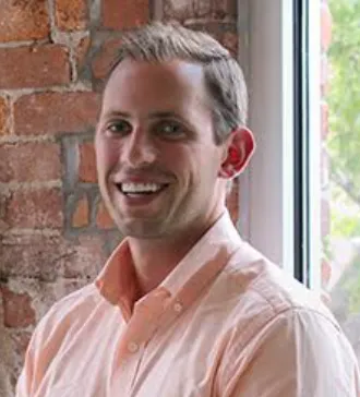 Man in button-down shirt and jeans