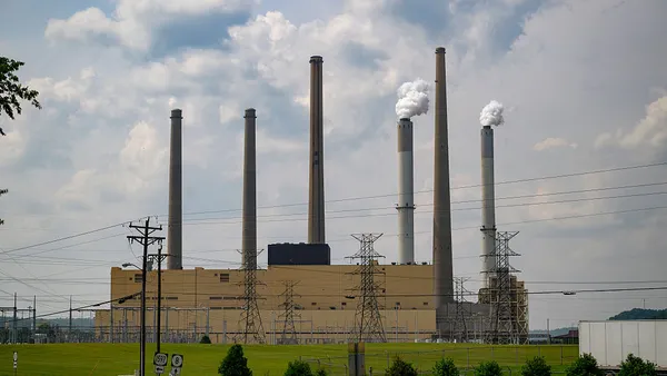 A coal-fired power plant with smokestacks.