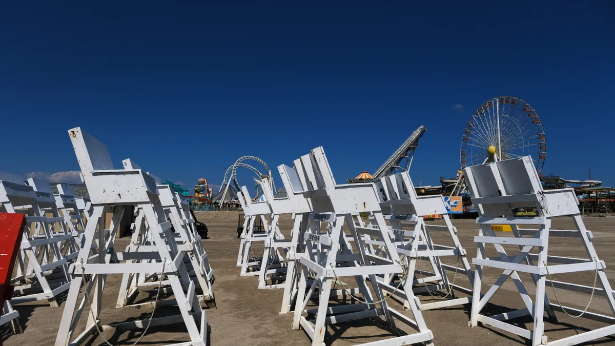 Lifeguard chairs and rescue boats are stored on the beach in Wildwood, New Jersey.