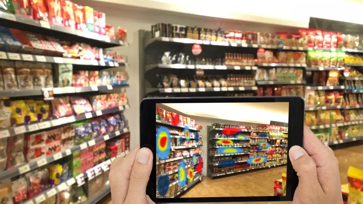 Person taking a photo of grocery store shelves with a tablet.