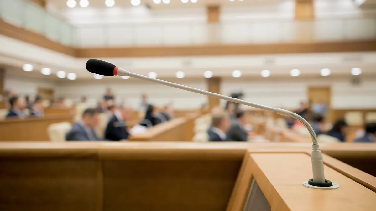 Session of Government. Conference room or seminar meeting room in business event. Academic classroom training course in lecture hall. blurred businessmen talking. modern bright office indoor