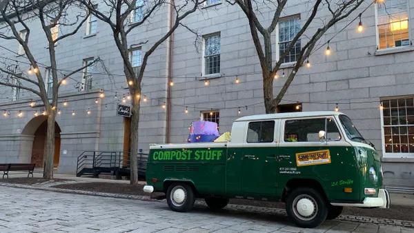 A VW Double Cab with the words "Compost Stuff" and the "Save That Stuff" logo