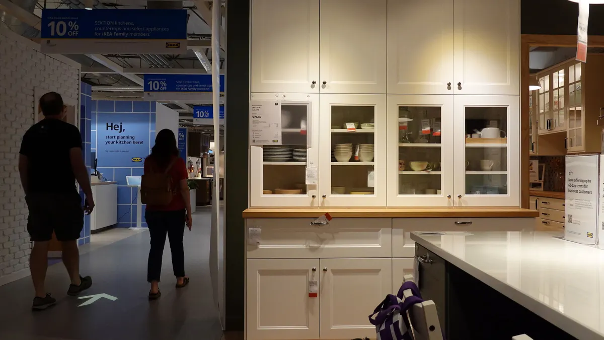 People walk by a kitchen cabinet display at an Ikea store on Sept. 26, 2025, in Emeryville, California.