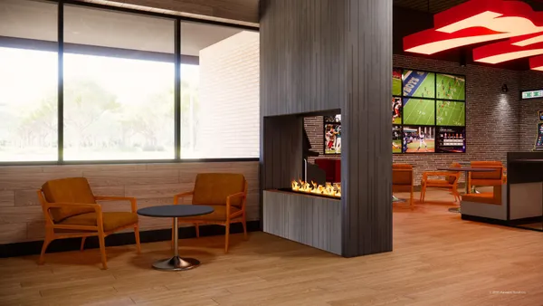 A rendering of the interior of a convenience store. There are tables and chairs, a fireplace, benches and TV screens on oen wall showing a variety of sports.