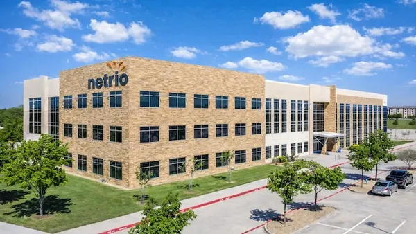 A large building with the corporate logo for the managed service provider netrio visible.
