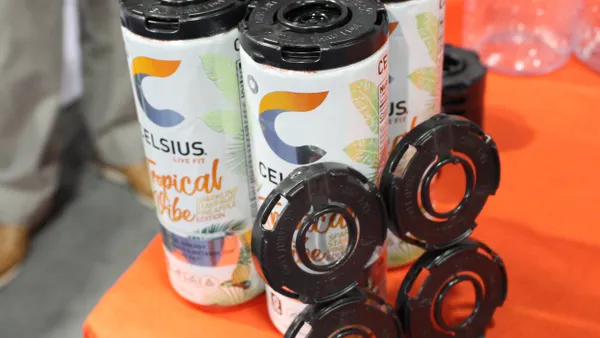 A four-pack of beverages with a black plastic child-resistant cap.