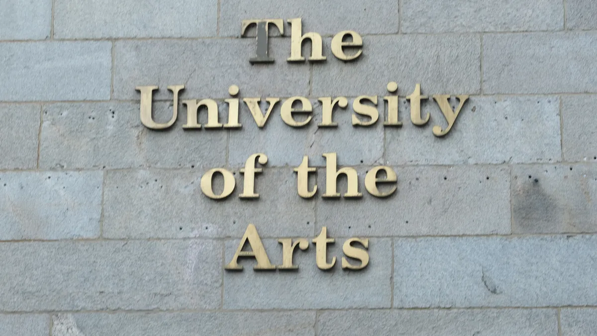 University of the Arts sign on campus in brass lettering.