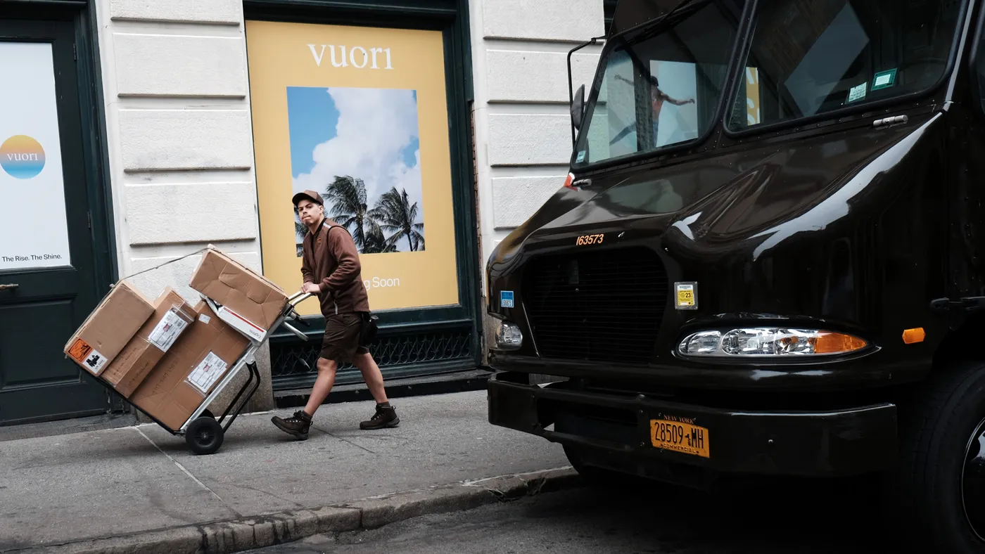 A UPS worker delivers boxes in Manhattan on April 26, 2022 in New York City.