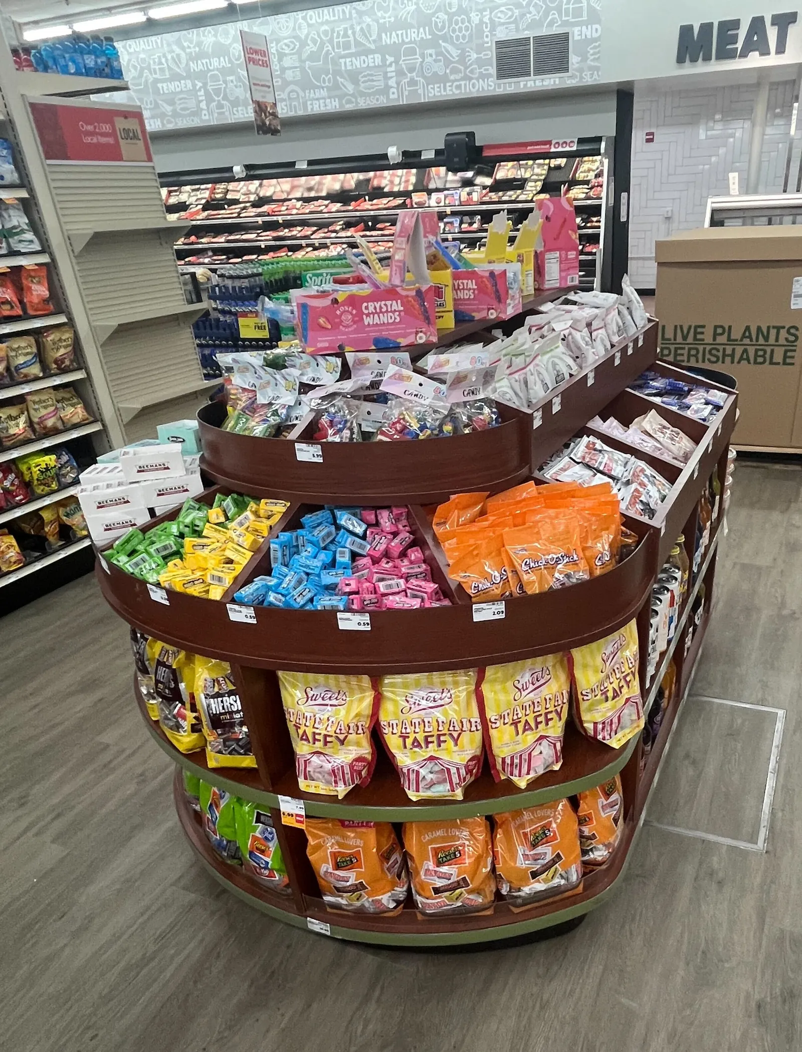 Oval-shaped candy display in central location of grocery store