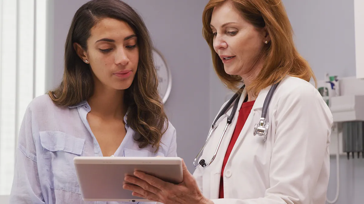 Female doctor talking to a female patient