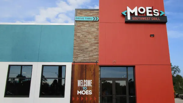 An image of a red, turquoise and white restaurant with Moe's signage