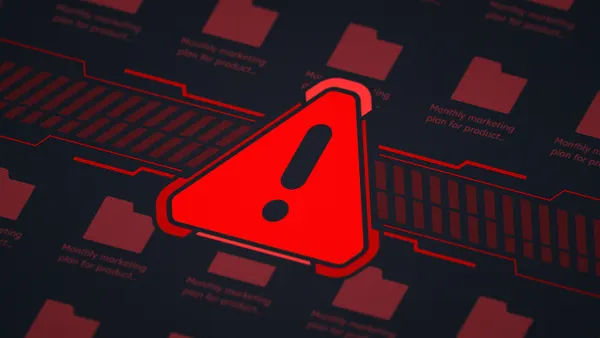 A red cybersecurity attack alert is pictured on a computer screen.