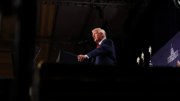 President Donald Trump stands at a podium while speaking at the 2025 Republican Issues Conference in Doral, Florida, on Jan. 27, 2025.