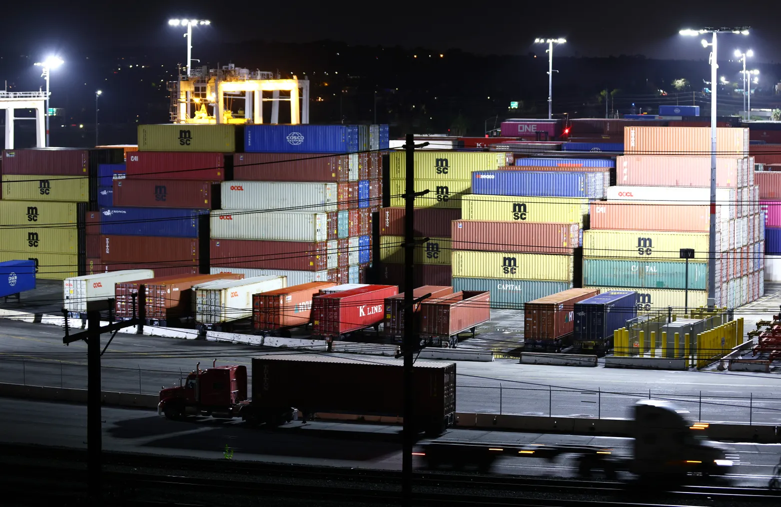 Containers wait to be picked up by trucks at the Port of Los Angeles.