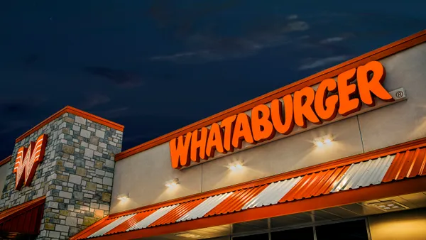 A Whatburger storefront. A sign outside reads, "Whataburger".