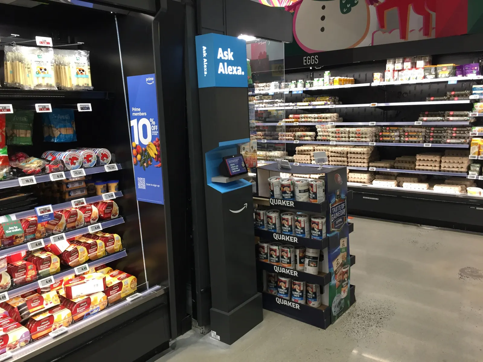 Kisok in supermarket with screen and sign that says &quot;Ask Alexa&quot;