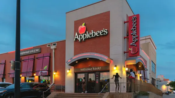 An evening photograph of a corner of an Applebee's restaurant