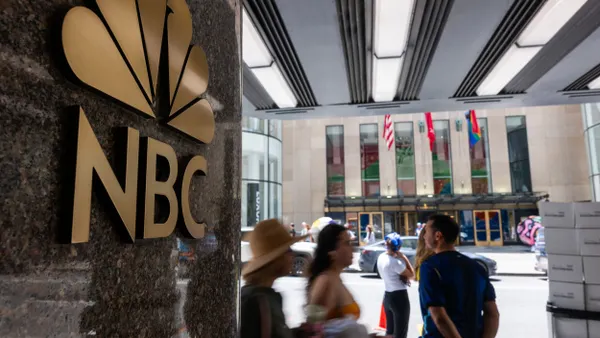 People walk by the Comcast building which houses NBC Studios in Manhattan on June 29, 2026 in NYC.