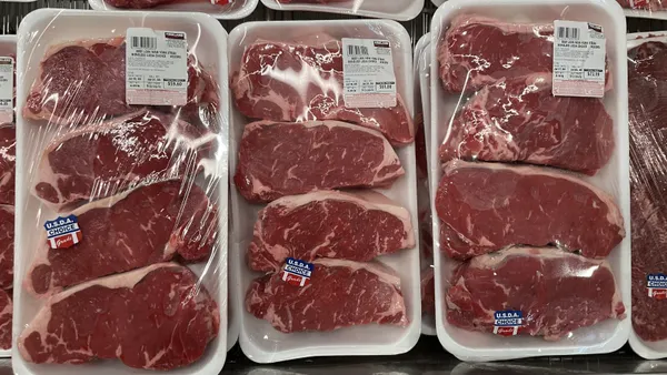 Packages of meat in a grocery store.