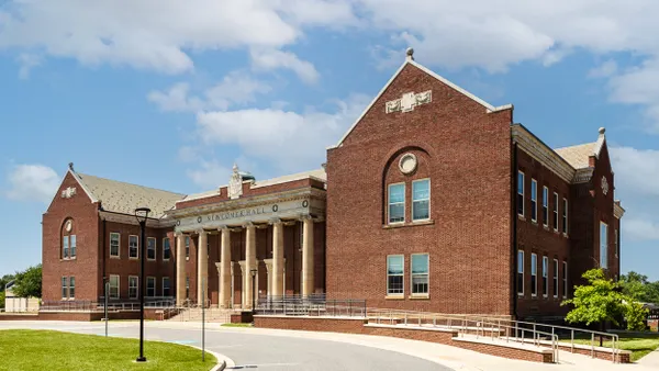 An academic building with classical columns is pictured on the campus of the Maryland School for the Blind.