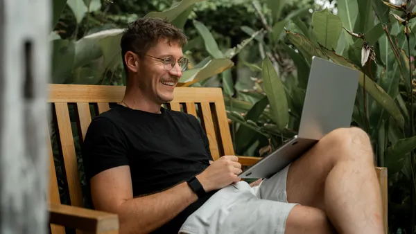 man relaxing laptop