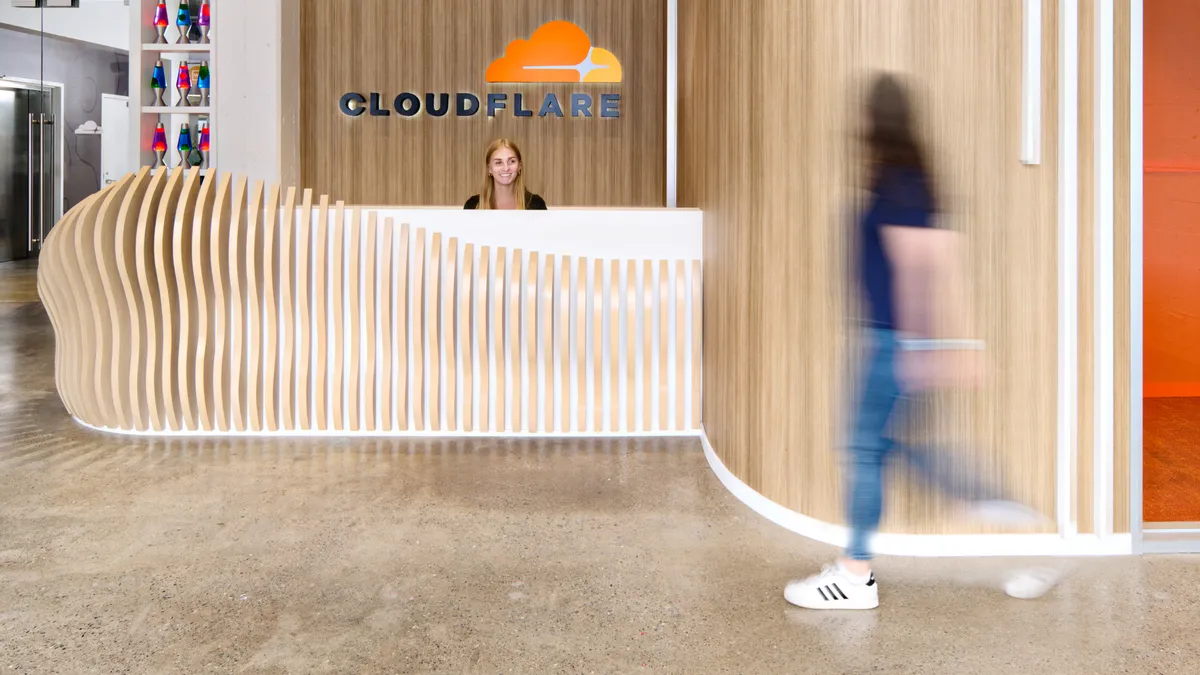 Reception desk inside Cloudflare office building.