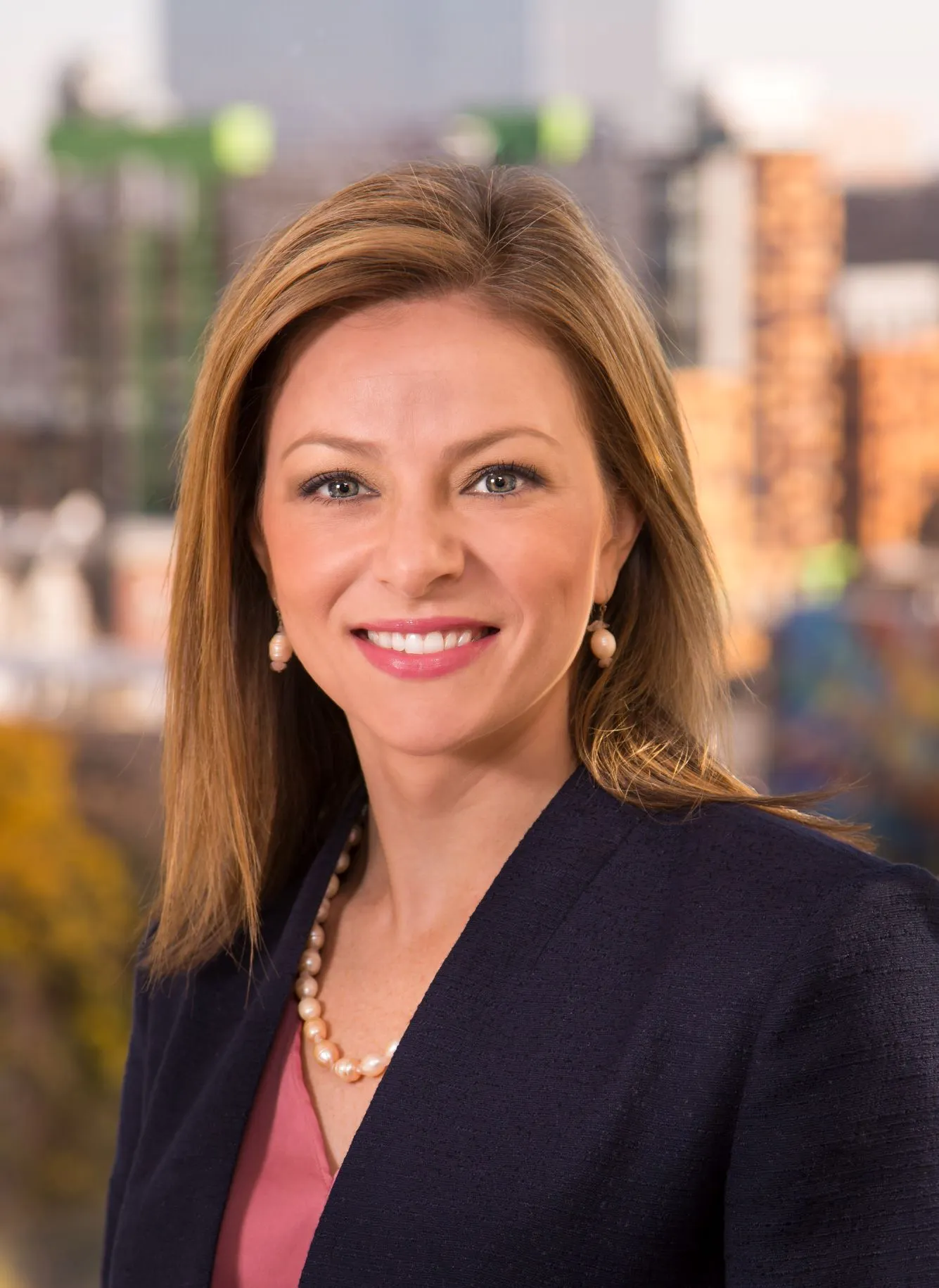 A professional headshot of Cara Castelli.