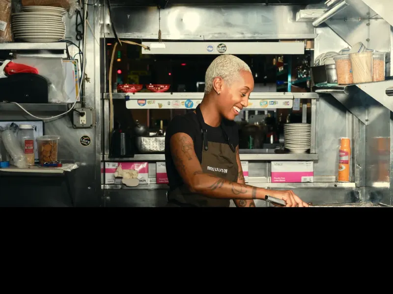 A chef working in Miss Lily's kitchen.