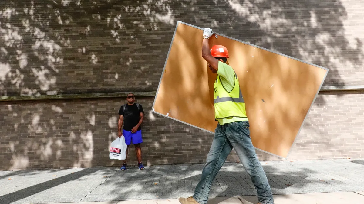 Construction worker walking on the campus of Yale University