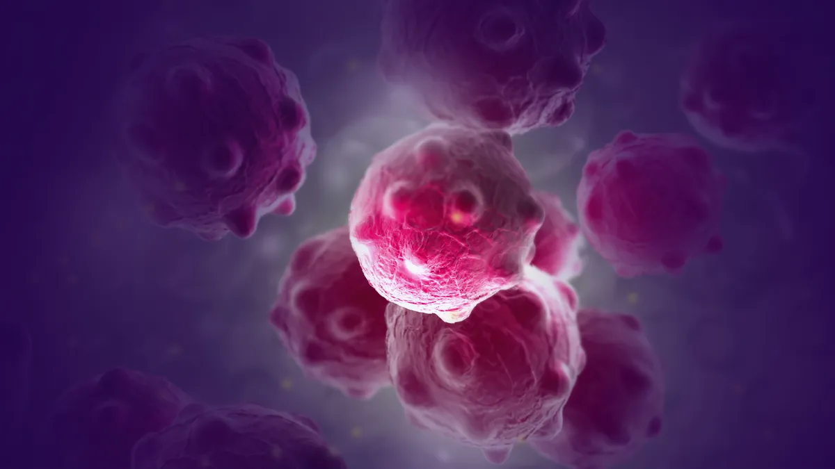 An illustration of cancer cells colored purple