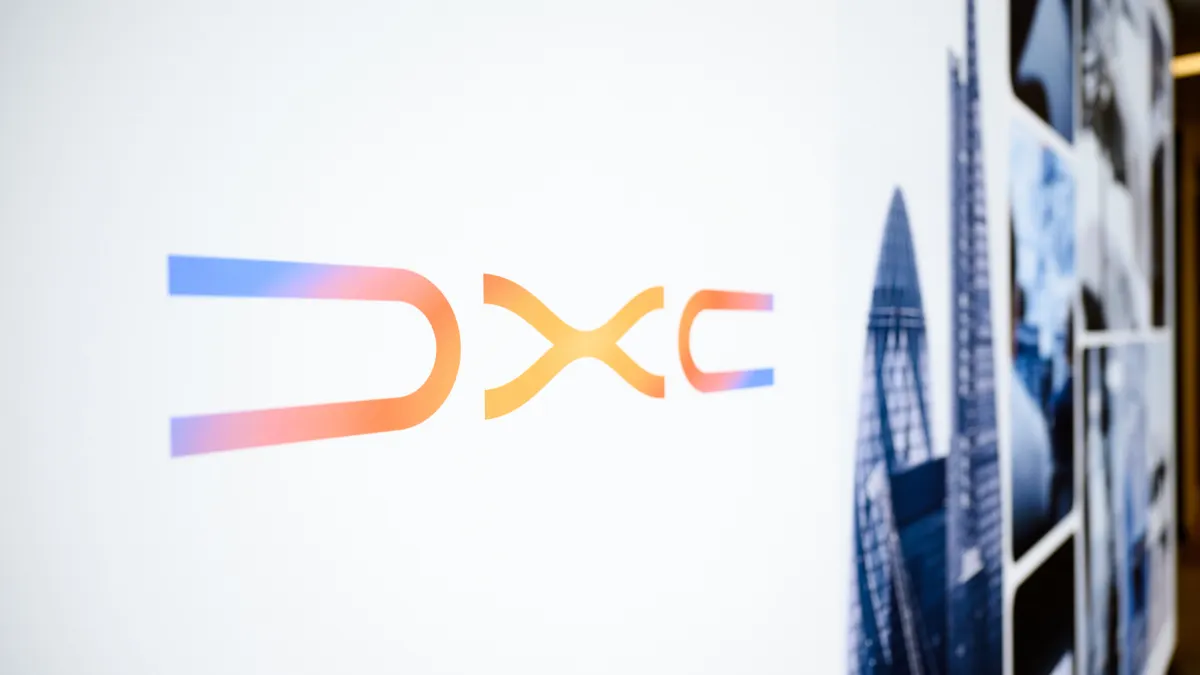 A logo with the corporate logo DXC is picture close up.