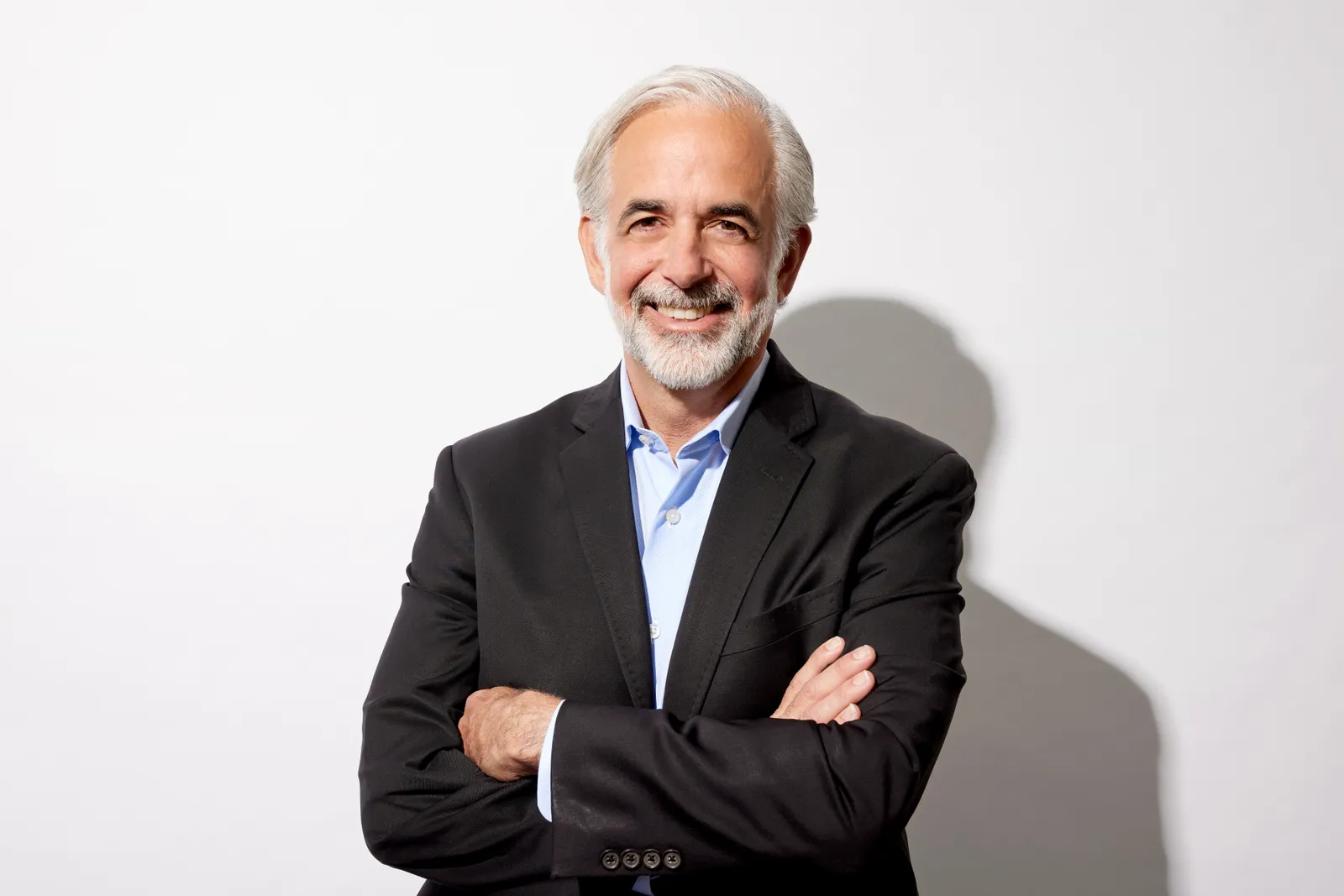 Paul Biondi, of Flagship Pioneering, stands for a photo against a neutral background.