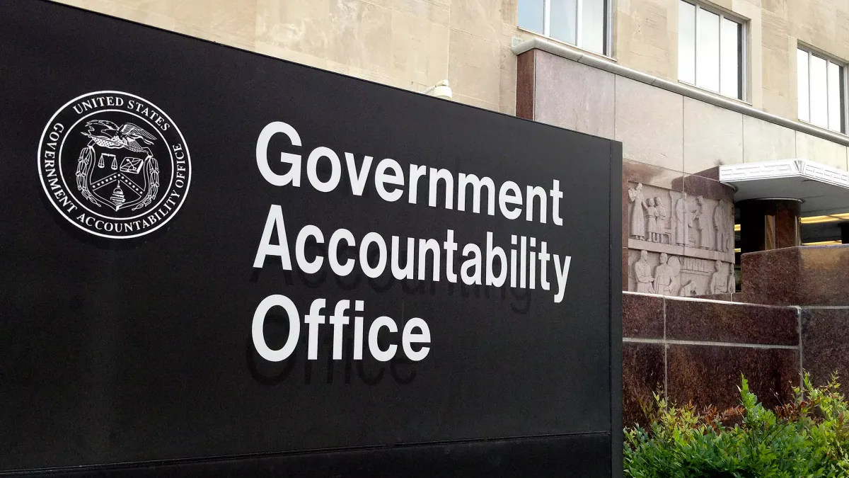 A sign that says "Government Accountability Office" and shows the GAO's seal sits in front of the agency's headquarters