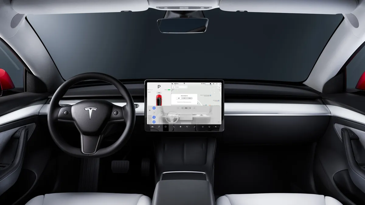 The interior of the Tesla Model 3 with its center-mounted touchscreen display