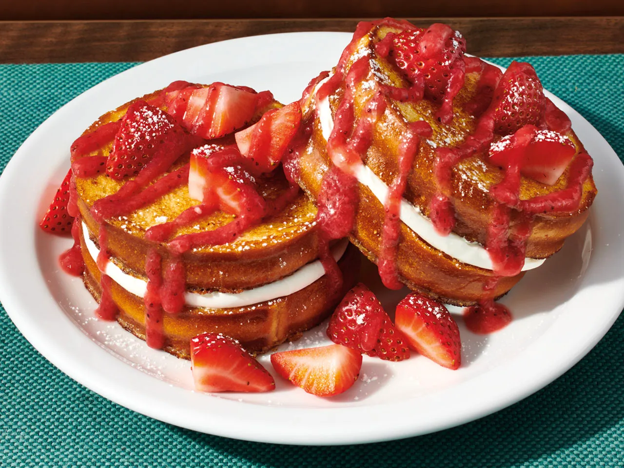 An image of Strawberry French Toast on a plate.