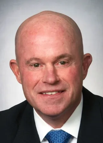 Headshot of man in suit