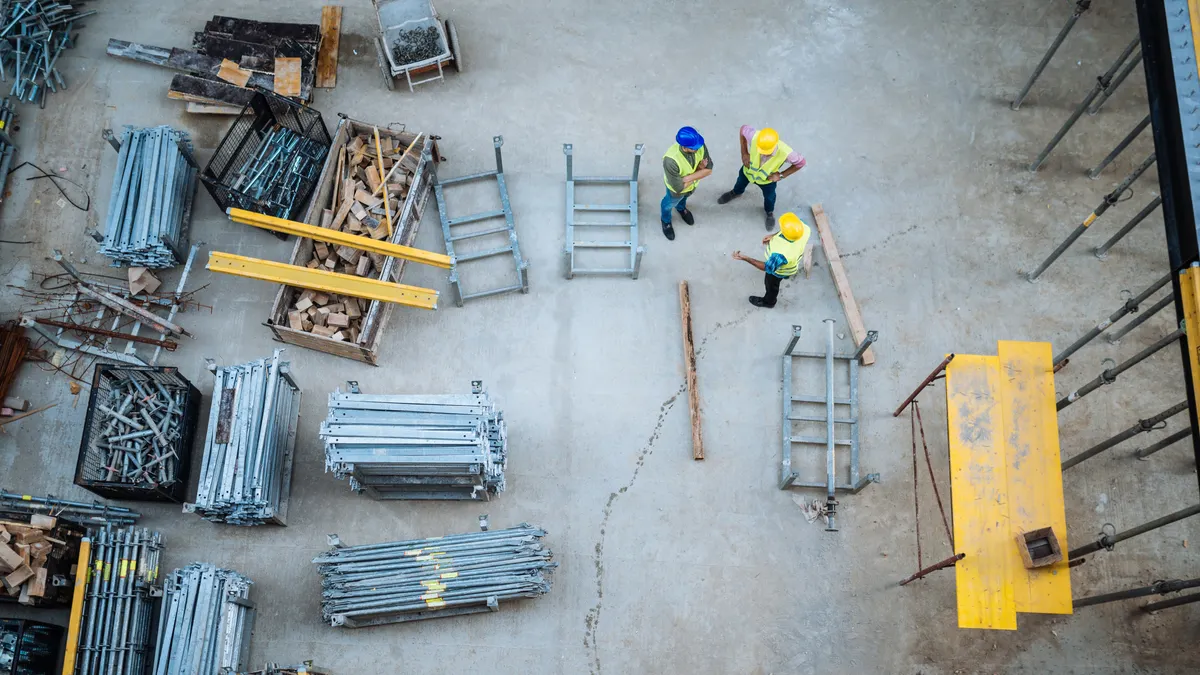 Construction materials lay on a jobsite, shown from above.