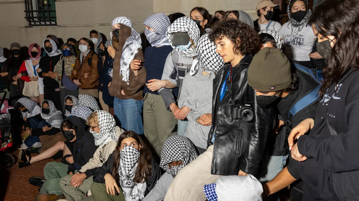 Protesters at Columbia University lock arms to block entry to Hamilton Hall.